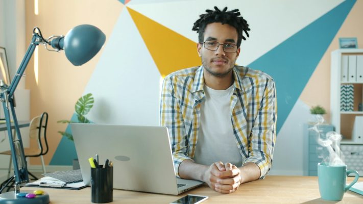 Small business owner working at a laptop on a modern website project