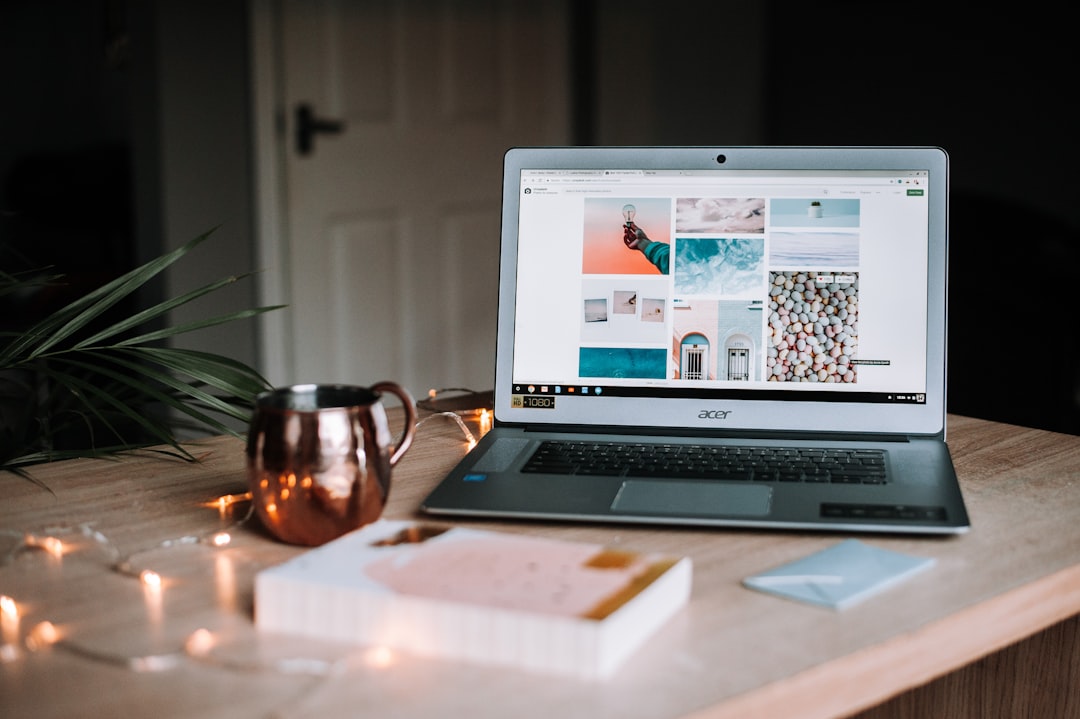 Small business website planning on a laptop with a notebook and workspace