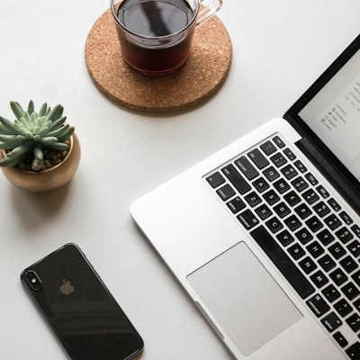 Business website content audit on a laptop and phone